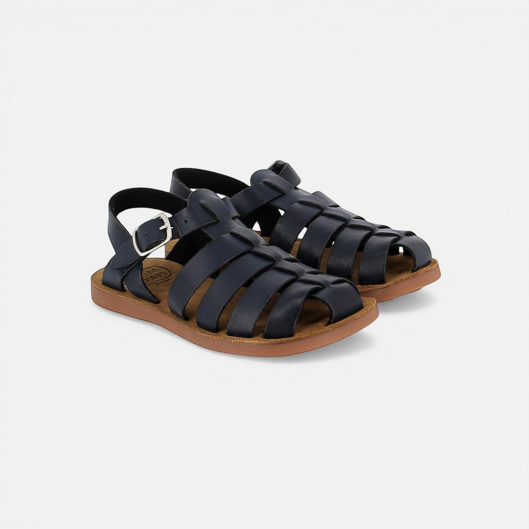 Pom d'Api dark blue leather gladiator sandals with buckle closure and brown rubber sole.