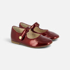 Ballerines Pom d'Api Daisy Baby en cuir vernis rouge rubis avec bride à bouton pression pour enfant