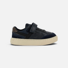 Basket garçon Pom d'Api bleu marine en cuir avec semelle cuvette, lacets élastiques et fermeture velcro.