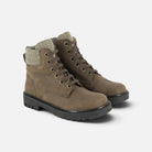 Boots montantes Pom d'Api en cuir marron avec col en tweed, lacets et semelle crantée noire style biker chic.