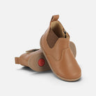 Bottines premiers pas Pom d'Api en cuir marron avec fermeture élastique et zip latéral pour bébé