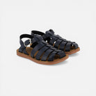 Pom d'Api dark blue leather gladiator sandals with buckle closure and brown rubber sole.