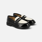 Mocassins Pom d'Api bicolores noir et blanc en cuir verni avec semelle en caoutchouc esprit collège